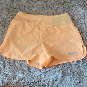 Nike tangerine orange running shorts for everyday! Worn once:) size XS!